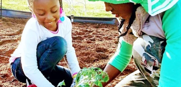 mum teaching-child-farming